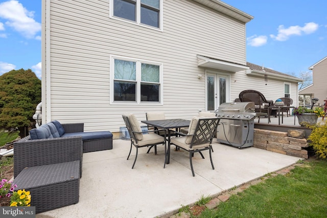 view of patio with grilling area, outdoor dining area, french doors, and outdoor lounge area