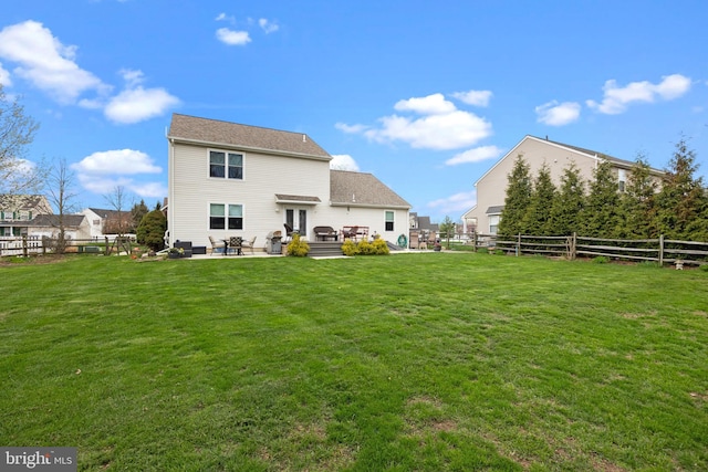 rear view of property with a patio area and french doors