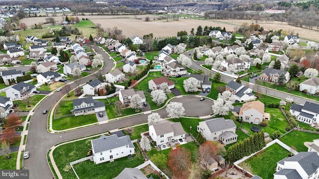 aerial view of property's location with nearby suburban area