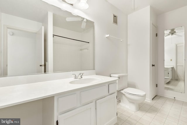 bathroom with toilet, a ceiling fan, vanity, and tile patterned flooring
