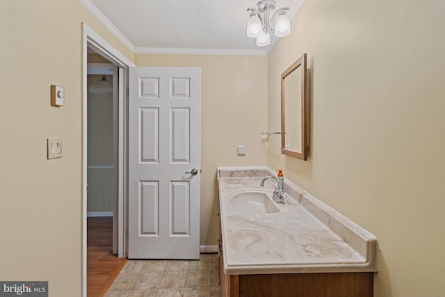 256 Frontier Trl, Lusby, MD 20657 - bathroom with vanity, ornamental molding, a chandelier, and baseboards