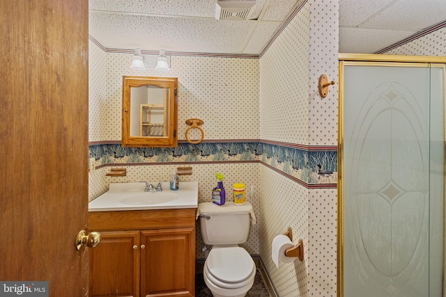 256 Frontier Trl, Lusby, MD 20657 - bathroom featuring wallpapered walls, a shower stall, vanity, and toilet