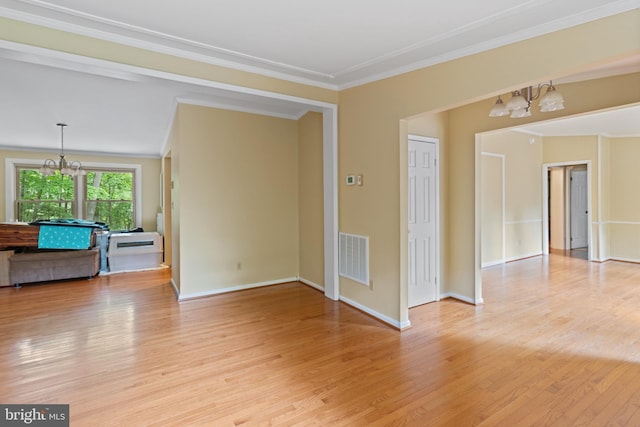 256 Frontier Trl, Lusby, MD 20657 - unfurnished room featuring a chandelier, light wood finished floors, ornamental molding, and baseboards