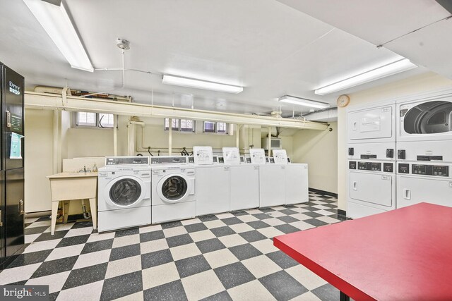 1954 Columbia Rd NW Unit 504, Washington, DC 20009 - community laundry featuring tile patterned floors, washer and clothes dryer, and stacked washer / dryer