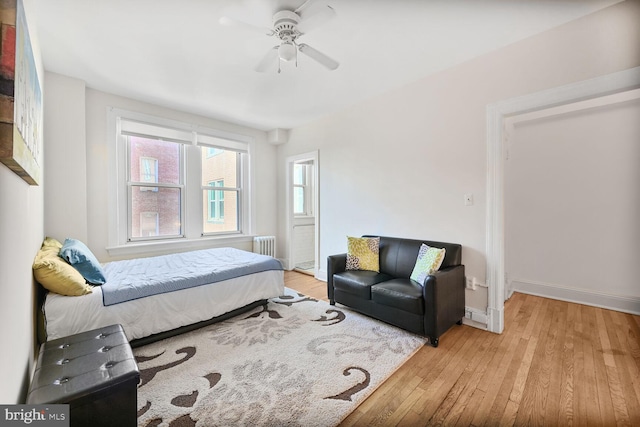 1954 Columbia Rd NW Unit 504, Washington, DC 20009 - bedroom featuring light wood finished floors, radiator heating unit, baseboards, and a ceiling fan
