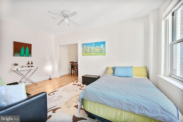 1954 Columbia Rd NW Unit 504, Washington, DC 20009 - bedroom featuring multiple windows, wood finished floors, ceiling fan, and baseboards