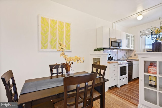 1954 Columbia Rd NW Unit 504, Washington, DC 20009 - dining room with light wood-style flooring