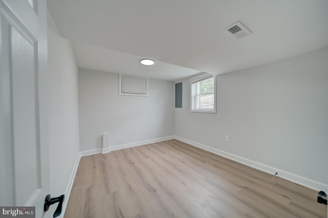 6802 Elbrook Rd, Lanham, MD 20706 - below grade area with electric panel, light wood-style flooring, baseboards, and visible vents