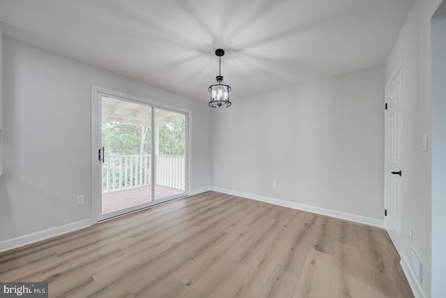 6802 Elbrook Rd, Lanham, MD 20706 - unfurnished dining area with baseboards, visible vents, a chandelier, and light wood-type flooring