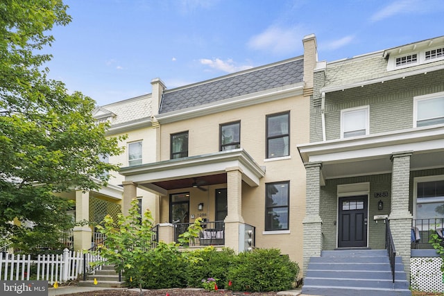 1286 Morse St NE Unit 2, Washington, DC 20002 - view of front facade with a porch, brick siding, and mansard roof