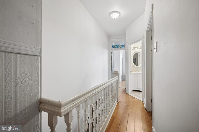 hall with light wood-style floors