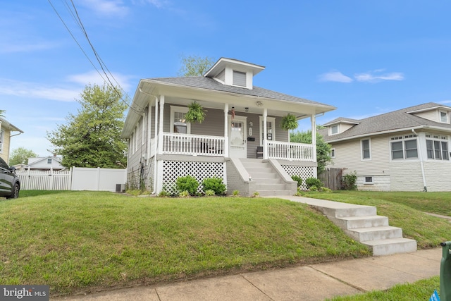 bungalow-style house featuring a porch, stairway, and central air condition unit