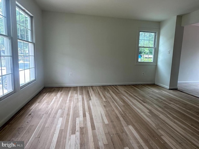 15213 Michigan Rd, Woodbridge, VA 22191 - spare room featuring plenty of natural light, wood finished floors, and baseboards