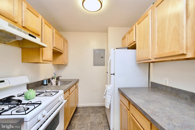 2845 Denver St SE Unit 204, Washington, DC 20020 - kitchen with light brown cabinets, under cabinet range hood, baseboards, white appliances, and a sink