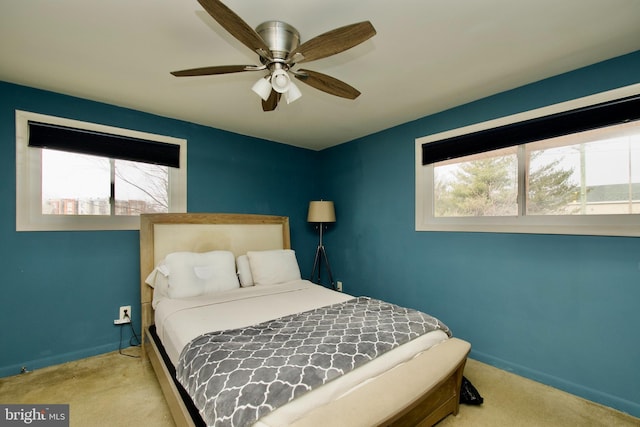 2845 Denver St SE Unit 204, Washington, DC 20020 - bedroom with carpet, baseboards, multiple windows, and a ceiling fan