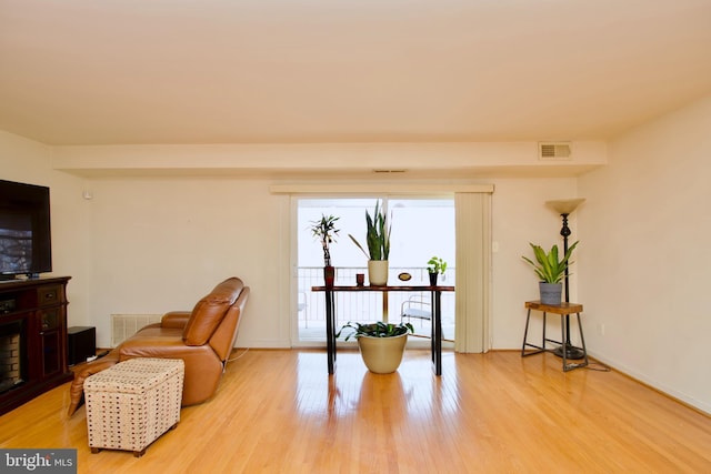 2845 Denver St SE Unit 204, Washington, DC 20020 - living area with light wood finished floors, baseboards, and visible vents