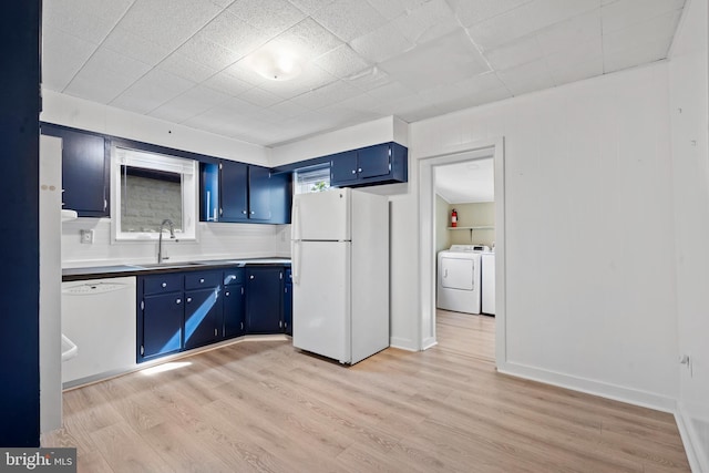 166 Meredith Ave, Bryn Mawr, PA 19010 - kitchen with light wood finished floors, a sink, washing machine and clothes dryer, white appliances, and blue cabinetry