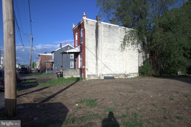 view of property exterior with stucco siding