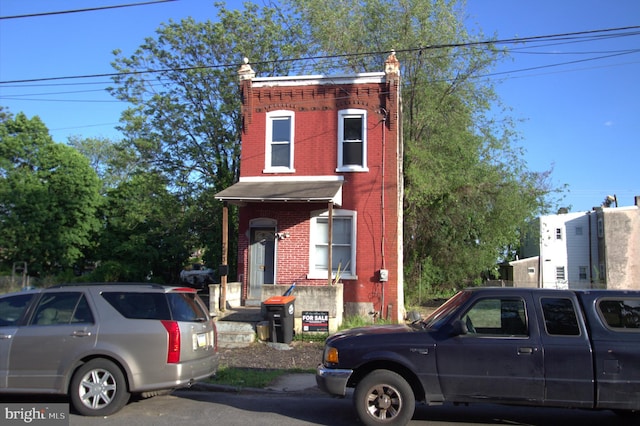 view of front of home featuring brick siding