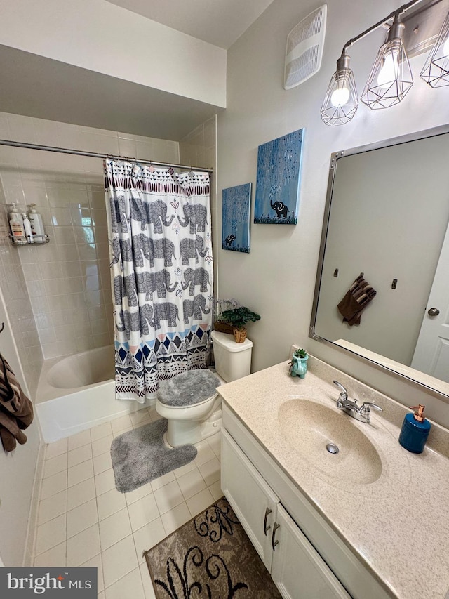bathroom with tile patterned floors, toilet, vanity, and shower / bath combo