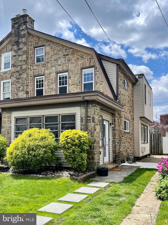 view of front of property featuring stone siding