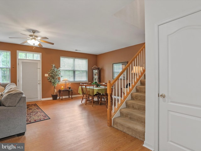104 Panmure, Stephens City, VA 22655 - living area with stairs, ceiling fan, light wood-style floors, and baseboards