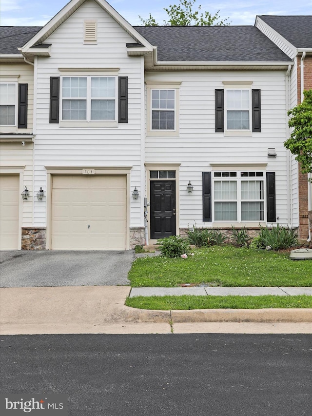 104 Panmure, Stephens City, VA 22655 - view of property featuring asphalt driveway, a garage, stone siding, and a shingled roof