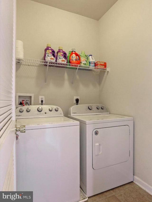104 Panmure, Stephens City, VA 22655 - clothes washing area featuring independent washer and dryer, light tile patterned floors, and baseboards