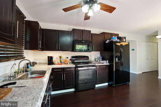 407 Bryan Point Rd, Accokeek, MD 20607 - kitchen with black appliances, dark wood finished floors, ceiling fan, dark brown cabinets, and light stone counters