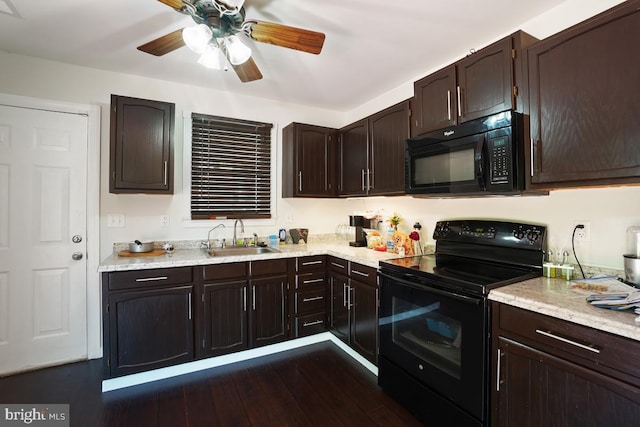 407 Bryan Point Rd, Accokeek, MD 20607 - kitchen featuring black appliances, dark brown cabinets, a ceiling fan, dark wood-type flooring, and light stone counters