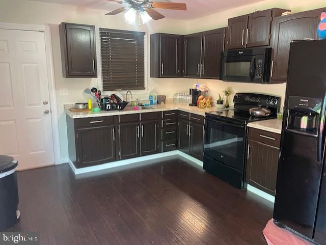 kitchen with black appliances, light countertops, ceiling fan, dark wood-style floors, and dark brown cabinetry