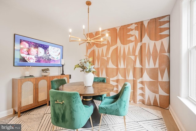 502 King Farm Blvd Unit 202, Rockville, MD 20850 - dining area featuring baseboards and a chandelier