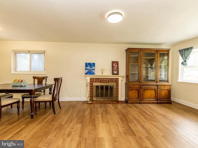 6215 Seminole Pl, College Park, MD 20740 - dining area with light wood-style floors, baseboards, and a fireplace