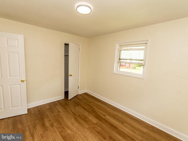 6215 Seminole Pl, College Park, MD 20740 - unfurnished bedroom featuring baseboards, dark wood finished floors, and a closet
