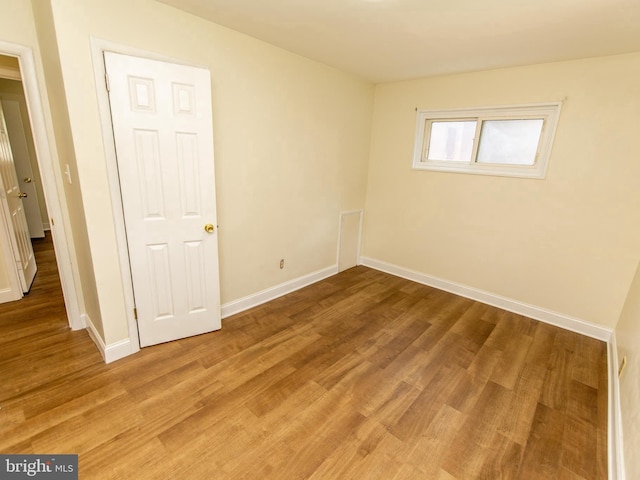 6215 Seminole Pl, College Park, MD 20740 - unfurnished bedroom featuring baseboards and light wood-style flooring
