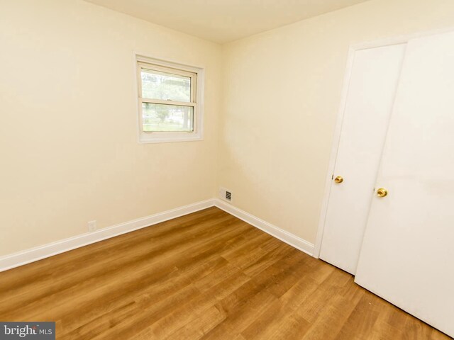 6215 Seminole Pl, College Park, MD 20740 - unfurnished bedroom with wood finished floors and baseboards