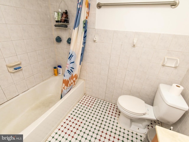 6215 Seminole Pl, College Park, MD 20740 - full bathroom with tile walls, toilet, and shower / bath combo