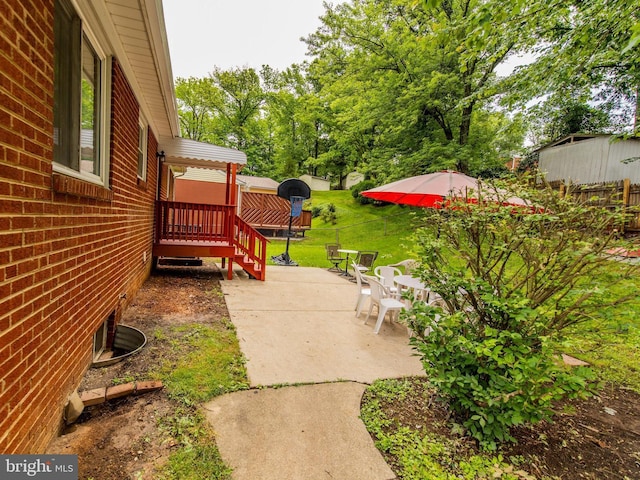 6215 Seminole Pl, College Park, MD 20740 - view of green lawn featuring a patio area and a deck