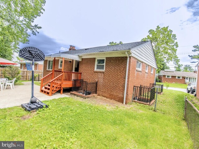 6215 Seminole Pl, College Park, MD 20740 - back of house with brick siding, a chimney, and a patio area