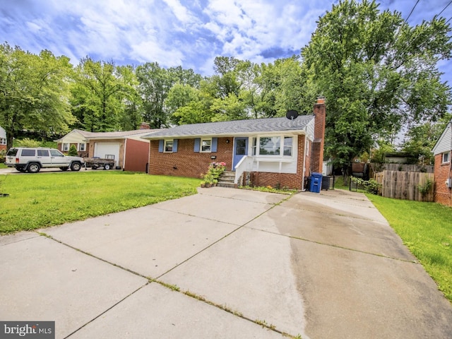 6215 Seminole Pl, College Park, MD 20740 - view of front of property with a chimney, brick siding, and driveway