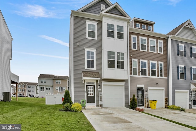 multi unit property with central air condition unit, a front yard, driveway, a garage, and a residential view