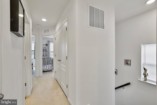 corridor with light colored carpet and recessed lighting