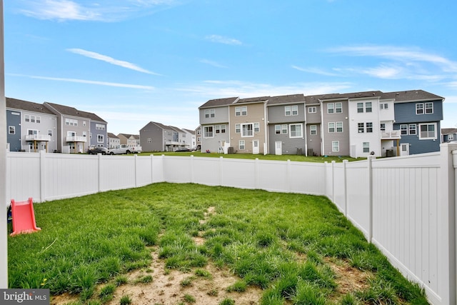 view of yard featuring a residential view