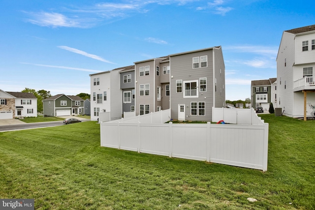 back of property featuring a residential view