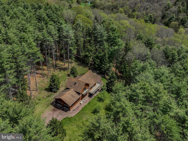 bird's eye view featuring a wooded view