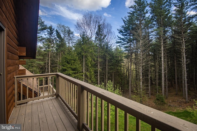 deck featuring a view of trees