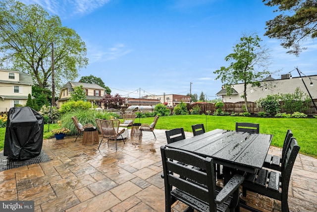 view of patio featuring grilling area and outdoor dining area
