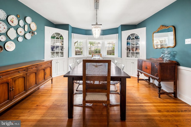 dining area featuring a chandelier and light wood-style floors