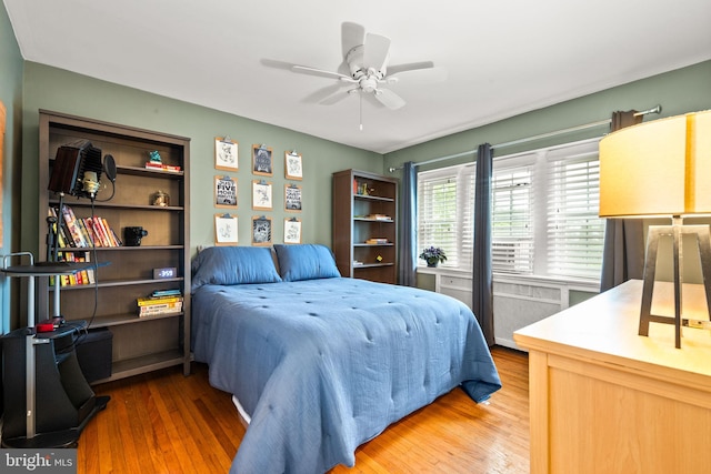 bedroom featuring wood finished floors and ceiling fan