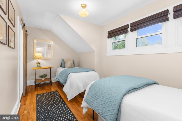 206 Shiley St, Annapolis, MD 21401 - bedroom with wood finished floors, baseboards, and vaulted ceiling